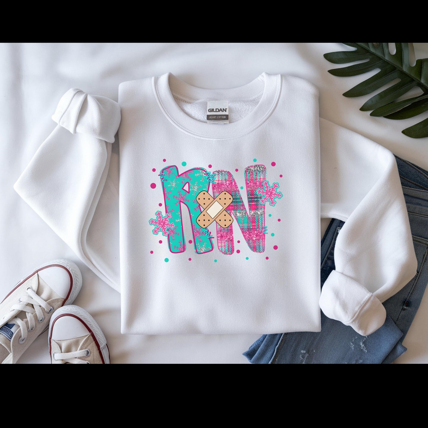 RN with a Bandage, snowflake sweater, Nurse crewneck sweatshirt, colorful bandage graphic, medical theme, Nurse Gift, Holiday Nurse Gift