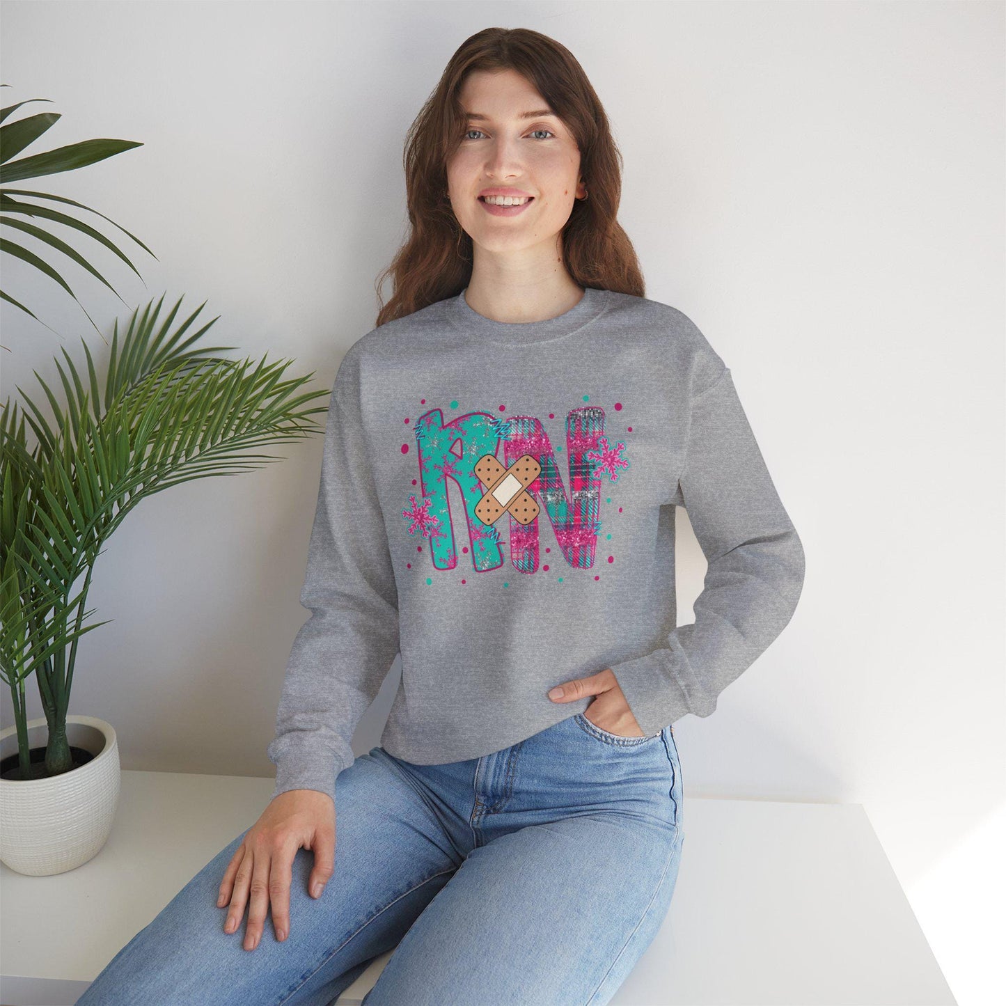 RN with a Bandage, snowflake sweater, Nurse crewneck sweatshirt, colorful bandage graphic, medical theme, Nurse Gift, Holiday Nurse Gift
