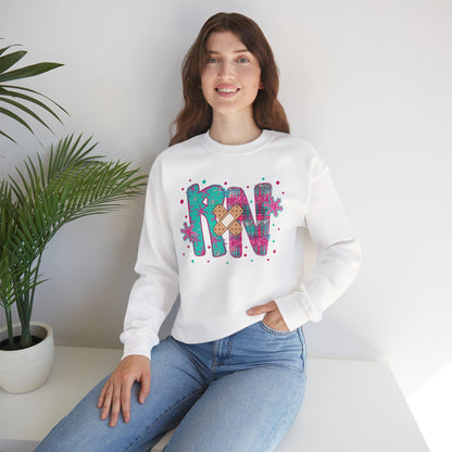 RN with a Bandage, snowflake sweater, Nurse crewneck sweatshirt, colorful bandage graphic, medical theme, Nurse Gift, Holiday Nurse Gift